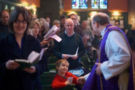 Bishop Paul greeting a little boy